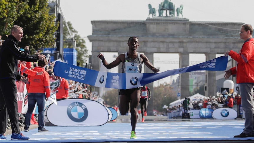 Ethiopia's Kenenisa Bekele crosses the line to win the Berlin Marathon on September 25, 2016.