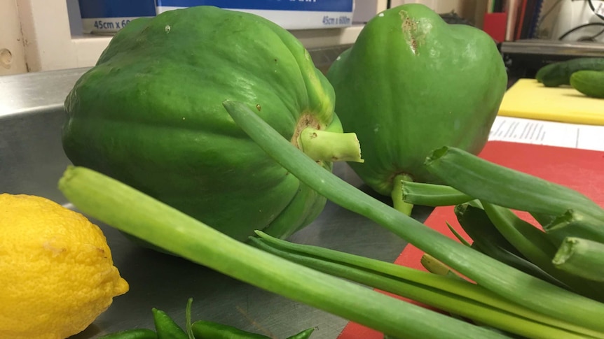 Green Paw Paw, yellow lemon, spring onions and green chillies