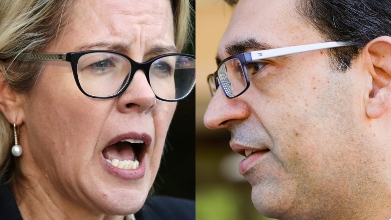 An extreme close up of a man and a woman wearing glasses