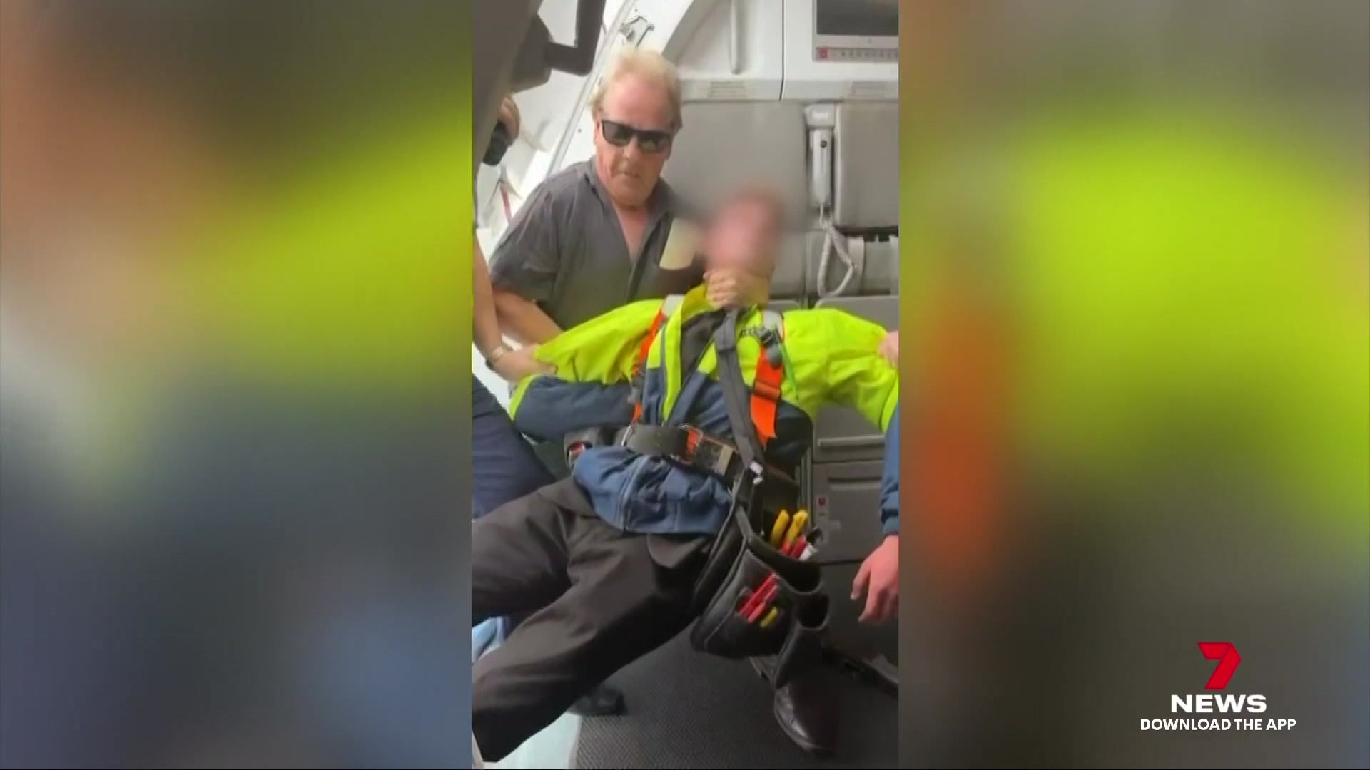 Man tackling youth to floor of plane