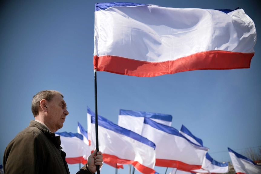 Man holds Crimean flag