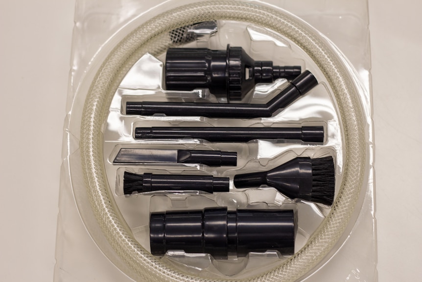 Several small brush heads that attach to a vacuum cleaner.