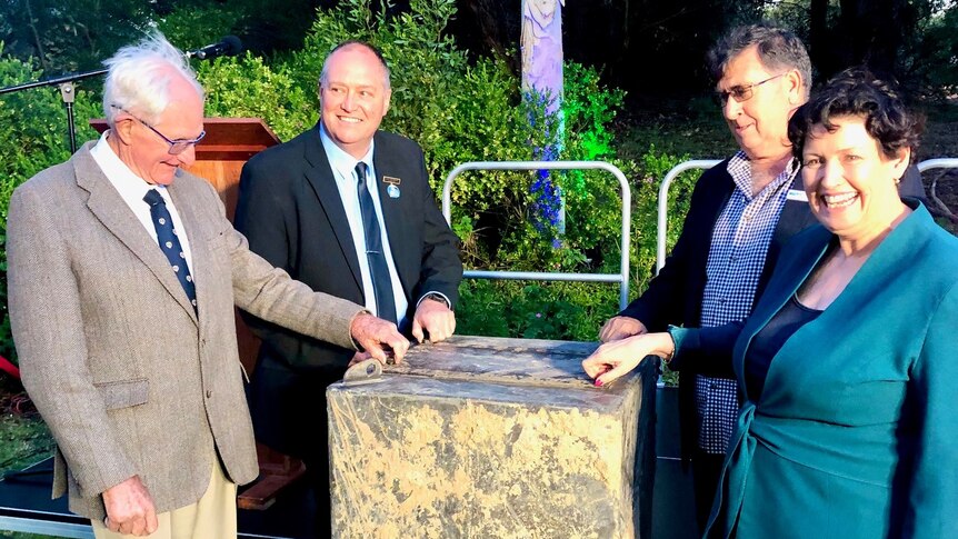 David Smallwood, Ron Chambers, Wes Graham and Jackie Jarvis open the bolts on the time capsule - TDL