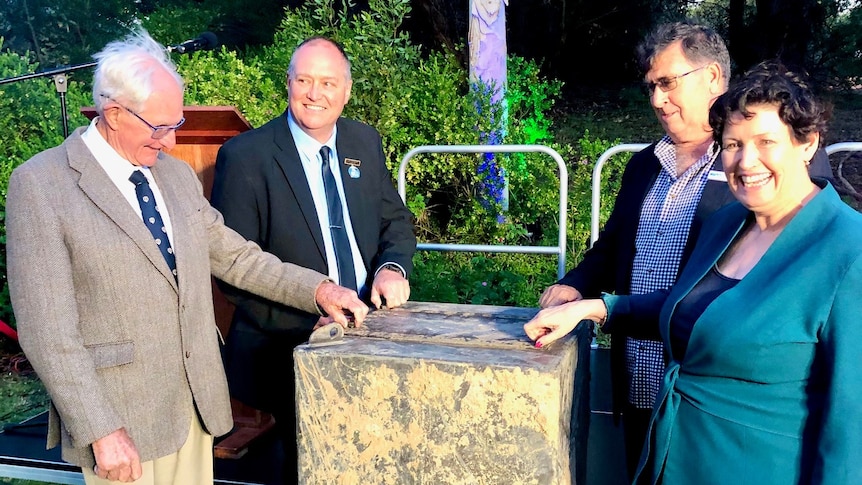 David Smallwood, Ron Chambers, Wes Graham and Jackie Jarvis open the bolts on the time capsule - TDL