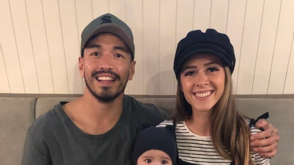 Victor Alonso and Rochelle Eardley sitting with son Romeo on their lap