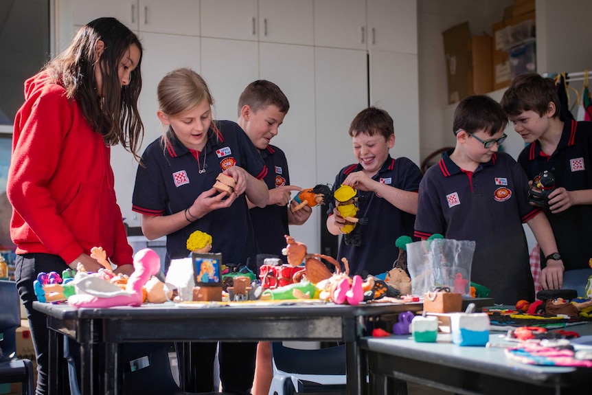 The Year 6 Strathewen Primary students putting the final touches on clay figurines used to make animated bushfire videos.