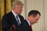 Donald Trump (left) pats his new chief of staff Reince Priebus on the back