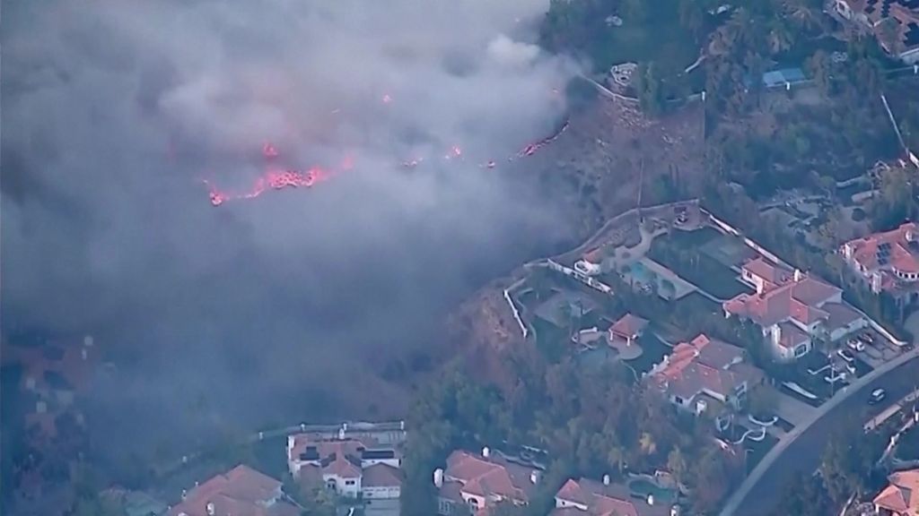 Aerial vision shows how close brush fires are to homes in Los Angeles ...
