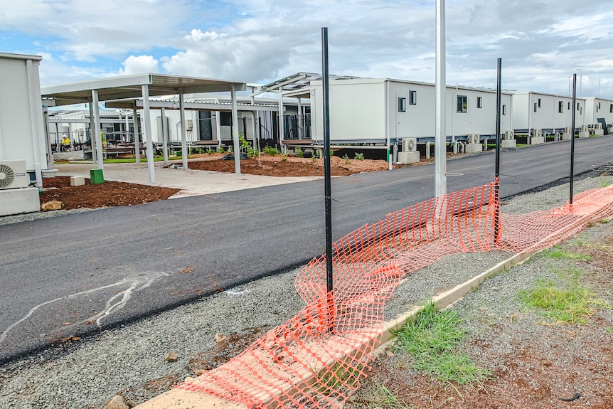 An incomplete fence at a building site