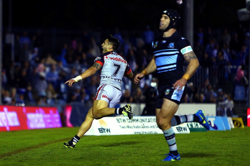 Shaun Johnson celebrates his match-winning try for the Warriors against Cronulla at Shark Park.