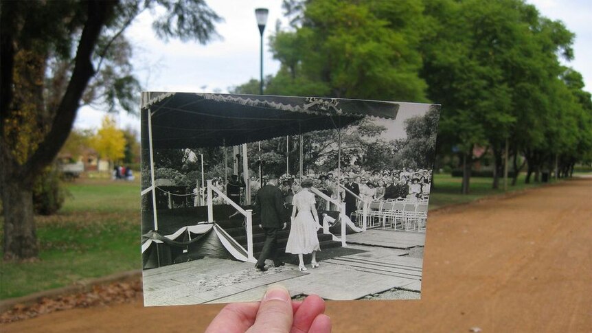 Queen Elizabeth II is escorted to a covered dais in Dubbo in 1954