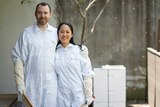 ABC Catalyst Bee Challenge winners Stuart and Jade pose in their beekeeping suits for a story about starting beekeeping.