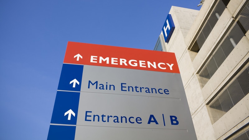 A sign indicating the entrance to an emergency department at a hospital.