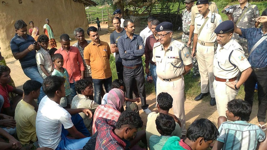 Indian police speak to villagers following witchcraft killings