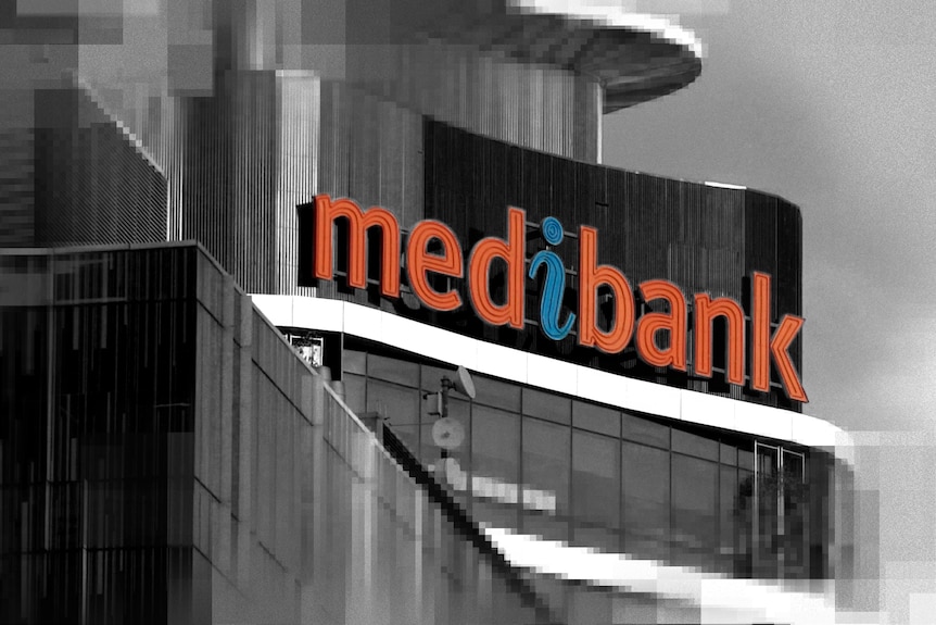 A sign on a building that says Medibank. The image is black and white except for the word. There is pixelation on the edges.