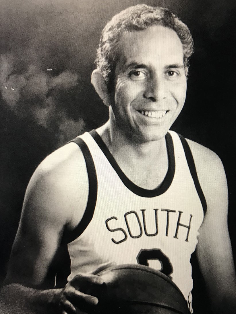 A black and white image of a basketballer in his guernsey.