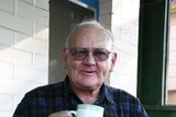 Warren Peters enjoys a cuppa at his home in Tempe