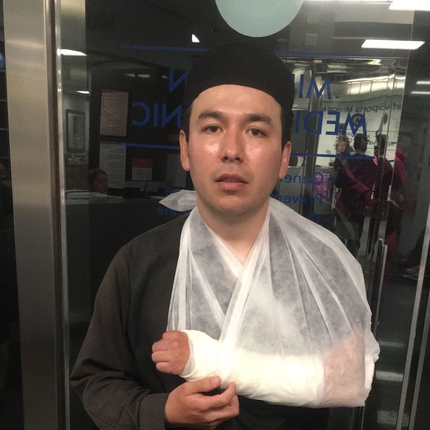 Foodora rider Icce Mejia and his broken arm