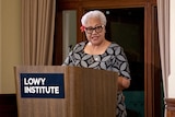 A photo of Samoan Prime minster at the Lowy Institute podium, during her speech.