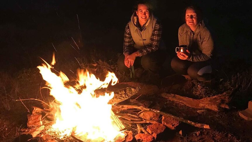 2 women and a campfire