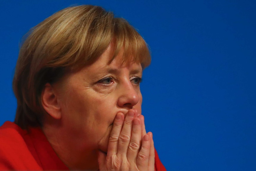German Chancellor Angela Merkel is pictured looking concerned at the CDU party convention in Germany