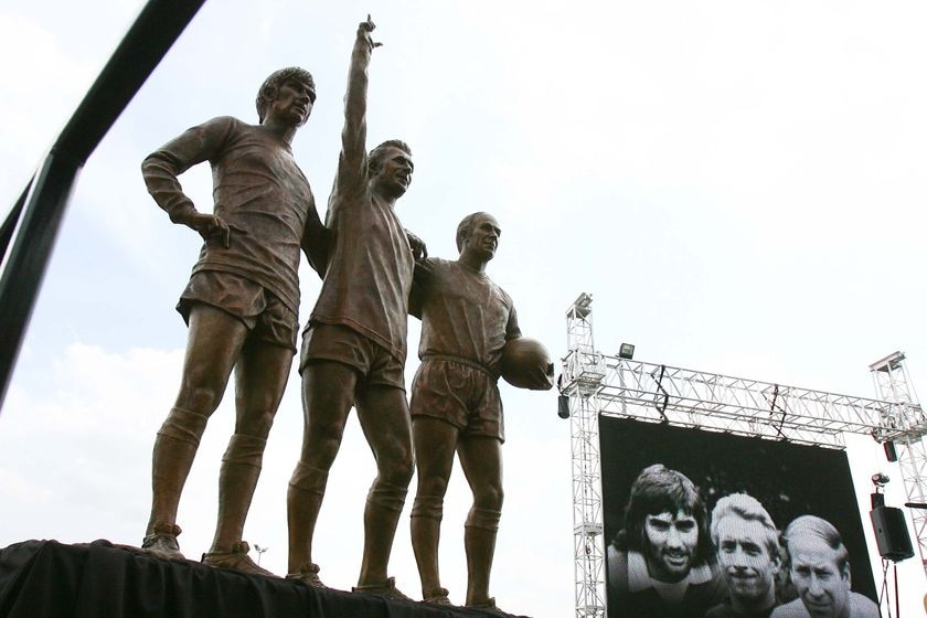 A statue showing three footballers