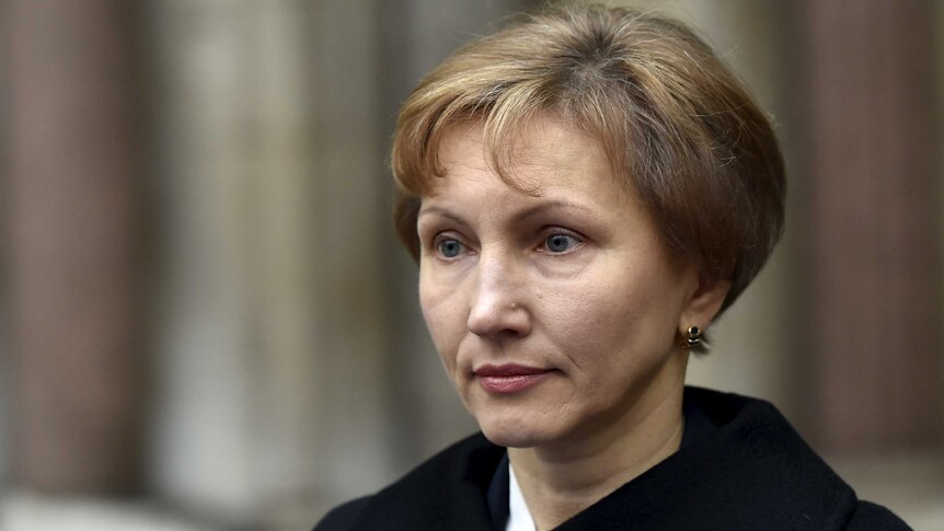 Widow Marina Litvinenko reads a statement outside of the Royal Courts of Justice in Lond.
