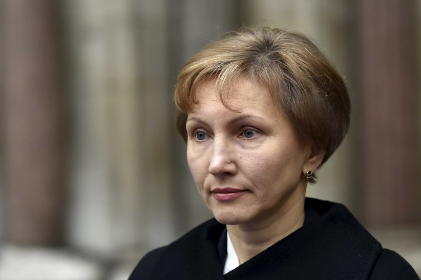 Widow Marina Litvinenko reads a statement outside of the Royal Courts of Justice in Lond.
