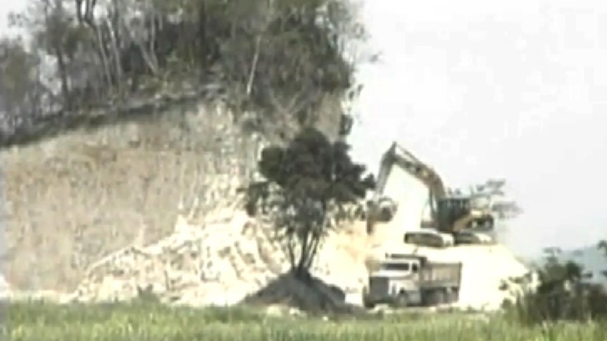 Demolition of a Mayan temple in Belize.