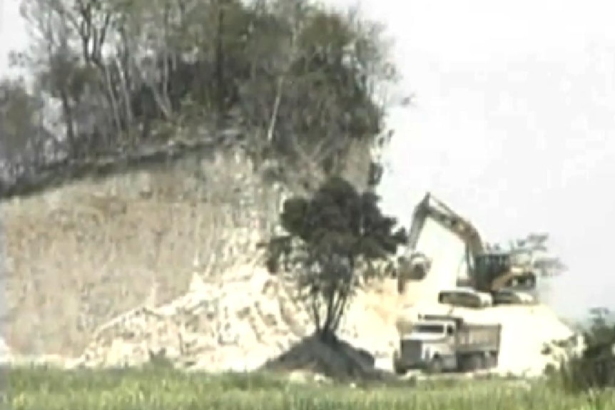 Demolition of a Mayan temple in Belize.