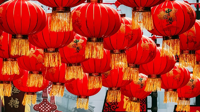 Red lanterns strung above a stress for Lunar New Year.