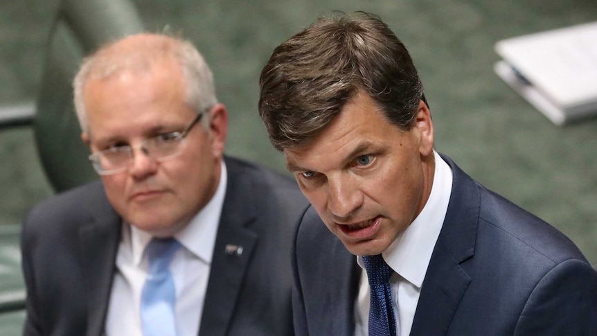 Angus Taylor speaks at the despatch with Scott Morrison looking on behind him
