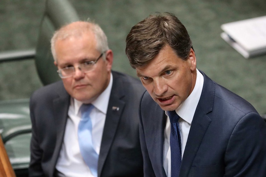 Angus Taylor speaks at the despatch with Scott Morrison looking on behind him