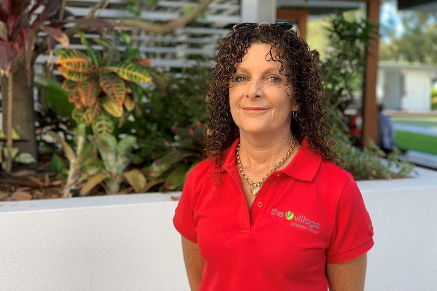 Headshot of Kath Gilhooley standing in a garden at The Village Yeronga.