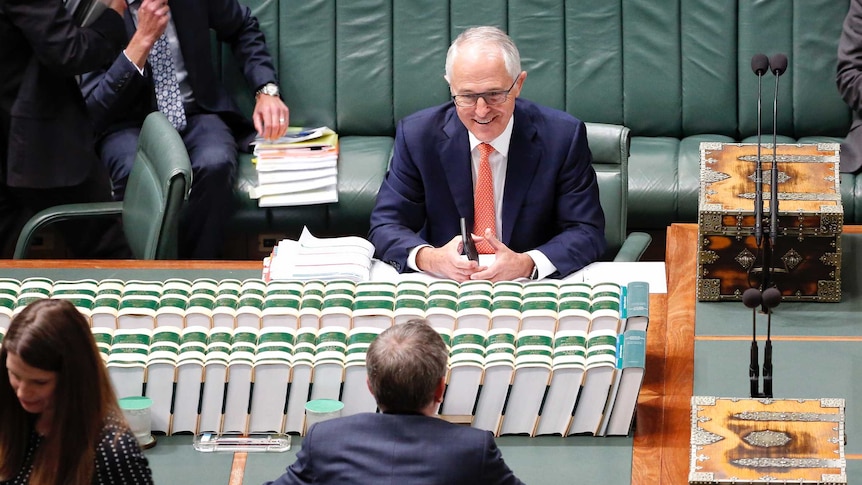 Malcolm Turnbull looks amused as he sits across from Bill Shorten in Question Time.