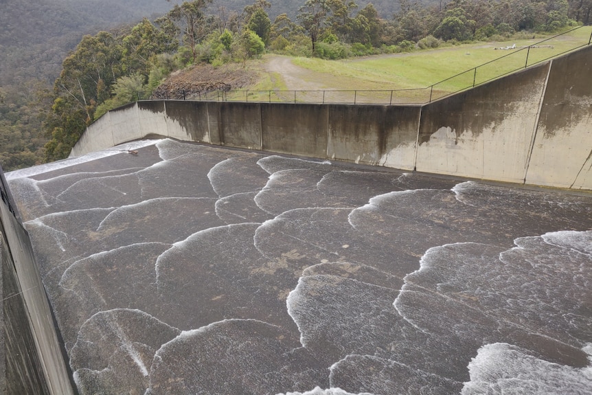 Thomson Dam spillway with water flowing through, as it spills for the first time in 26 years.