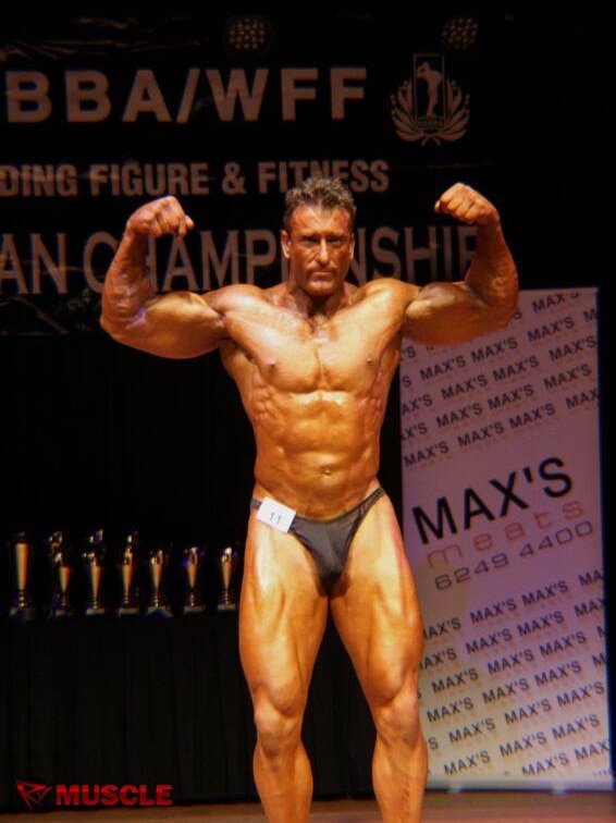 Mark Jones flexes his muscles at a bodybuilding competition.