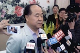 Chinese writer Mo Yan talks to the media in his hometown Gaomi, Shandong province. He won the 2012 Nobel prize for literature.