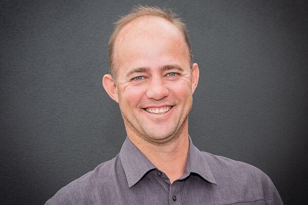 head shot of man smiling