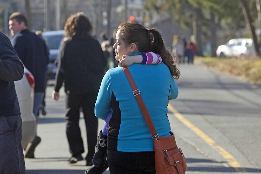 A parent leaves Sandy Hook Elementary School