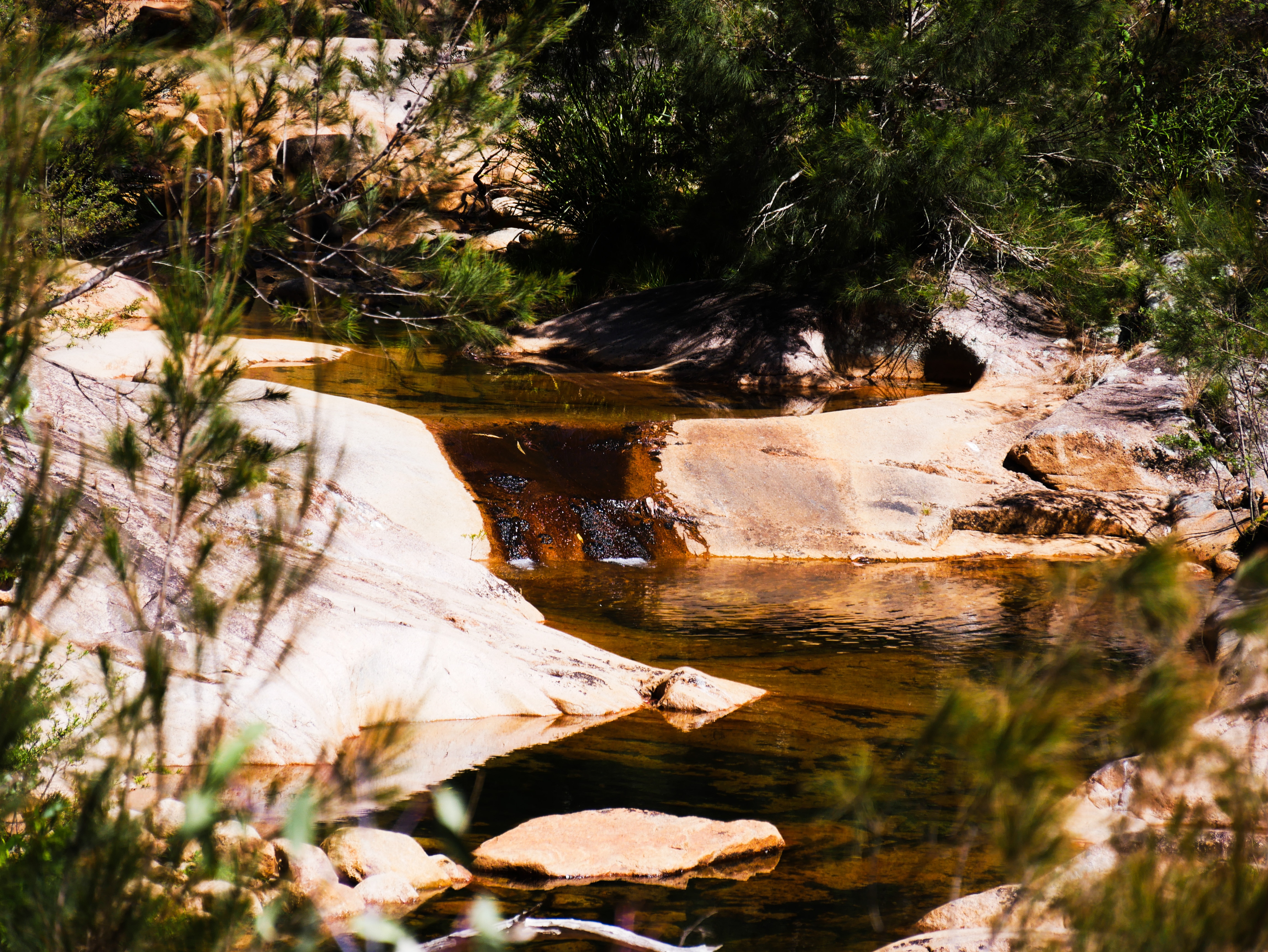 a river of water flows through rocks