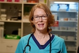 Fiona Mardling smiling in a portrait, wearing a blue clinic uniform and a stethscope around her neck.