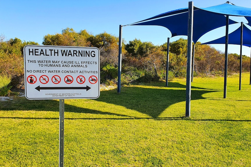 A health warning sign at Jurien Marina, September 2021