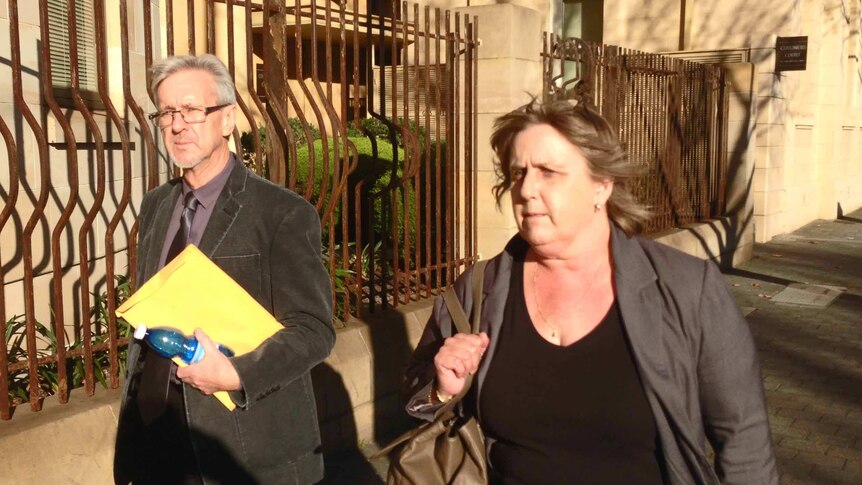 Tony Halczuk leaving court with ACIS lawyer Therese Karpinski