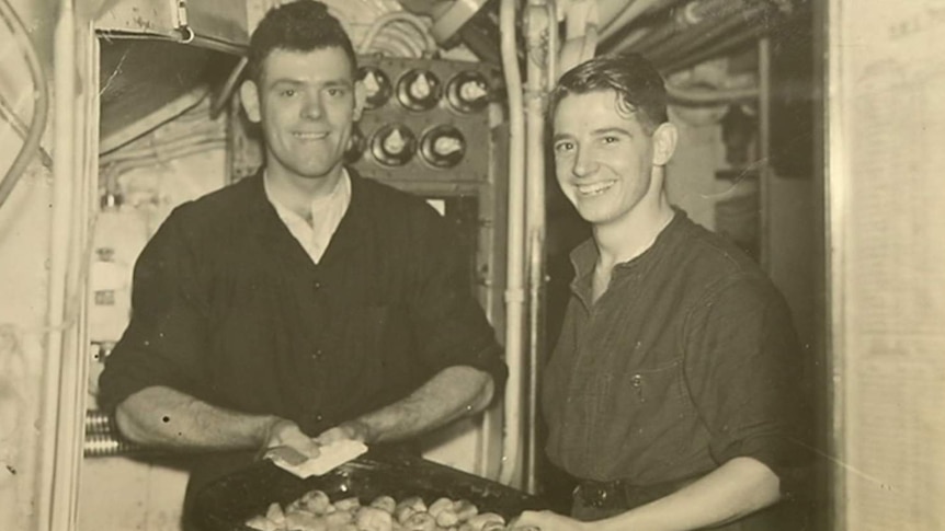Black and white photo of former Geelong POW Bob Appleton with crew member on submarine
