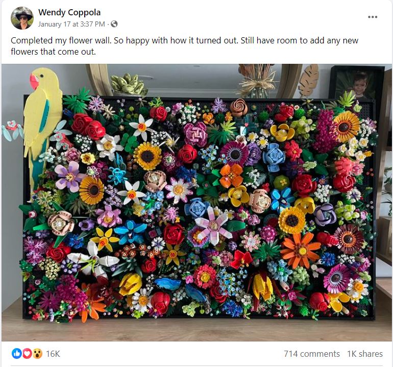 A social media post with a photo of a large artwork made of Lego flowers.