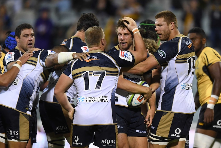 Kyle Godwin celebrates a try for the Brumbies