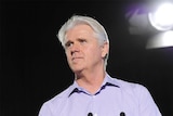 NBN Co chief executive Bill Morrow in front of a dark background.