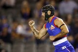 AFL player celebrates during a match