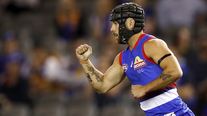 AFL player celebrates during a match